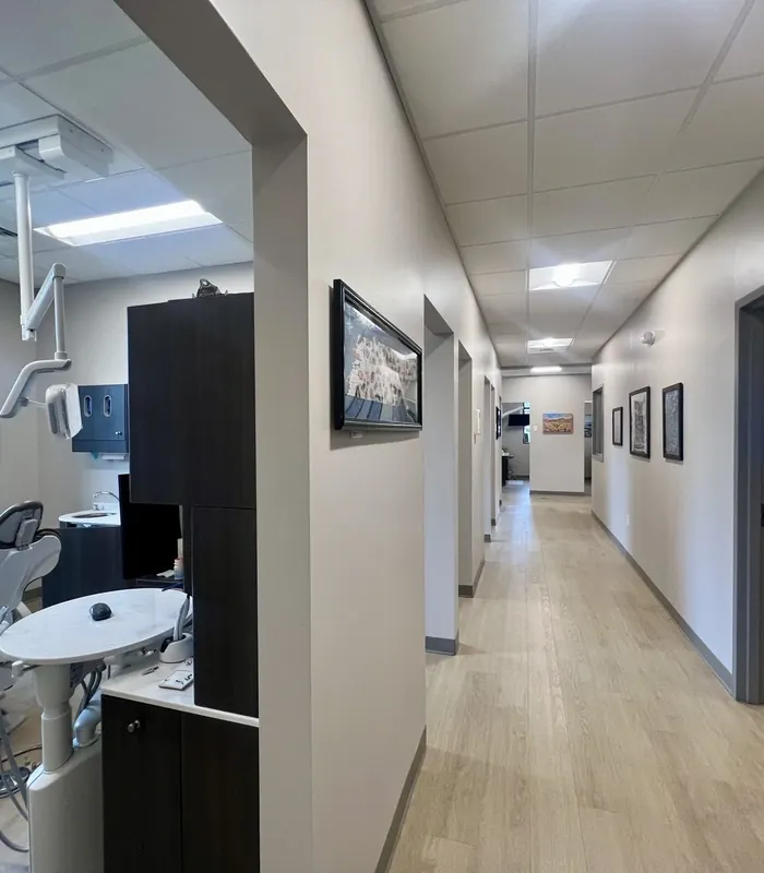 The corridor to the treatment rooms, with an operatory open on the left.