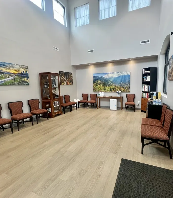 Rows of seating along the waiting room wall.