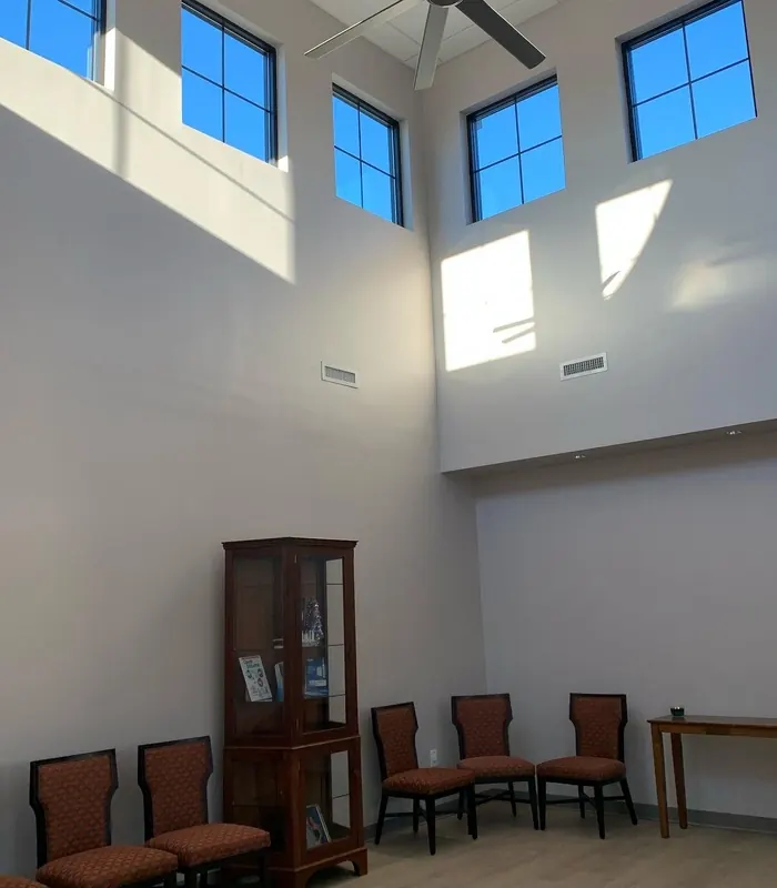 The double-height waiting room with clerestory windows.
